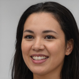 Joyful asian young-adult female with long  brown hair and brown eyes