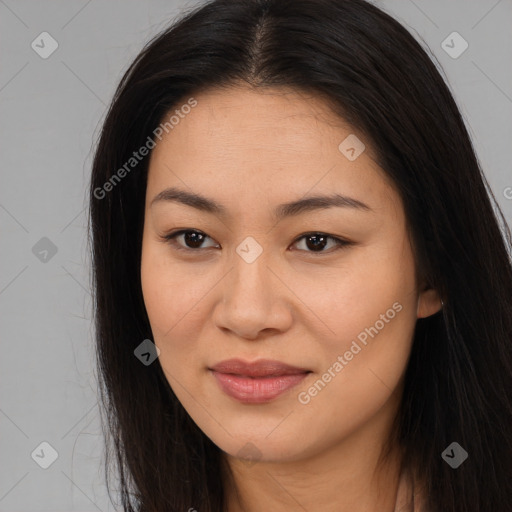 Joyful asian young-adult female with long  brown hair and brown eyes