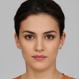 Neutral white young-adult female with short  brown hair and brown eyes