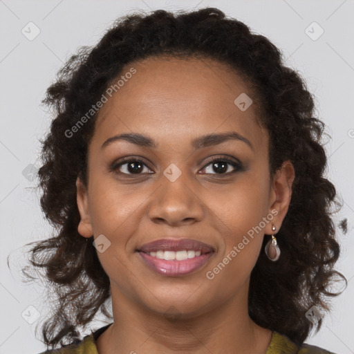 Joyful black young-adult female with long  brown hair and brown eyes