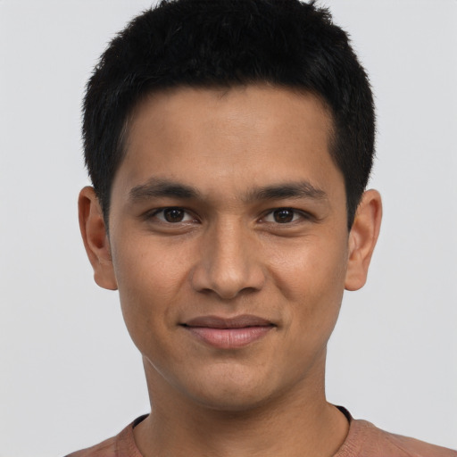 Joyful asian young-adult male with short  black hair and brown eyes