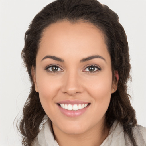 Joyful white young-adult female with long  brown hair and brown eyes