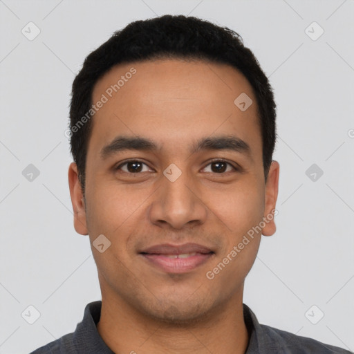 Joyful latino young-adult male with short  black hair and brown eyes