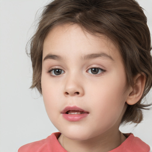 Joyful white child female with medium  brown hair and brown eyes