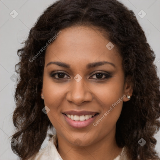 Joyful black young-adult female with medium  brown hair and brown eyes