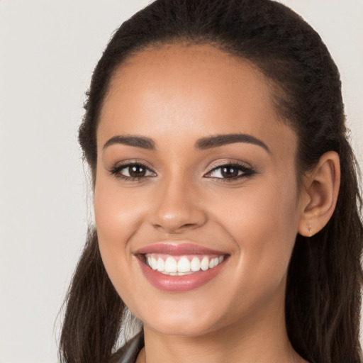 Joyful white young-adult female with long  brown hair and brown eyes