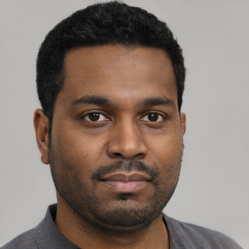 Neutral black young-adult male with short  black hair and brown eyes
