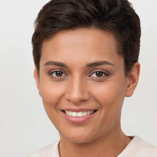 Joyful white young-adult female with short  brown hair and brown eyes