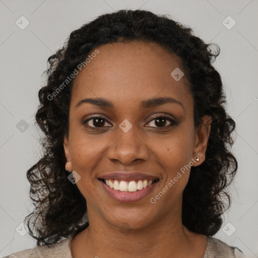 Joyful black young-adult female with long  brown hair and brown eyes