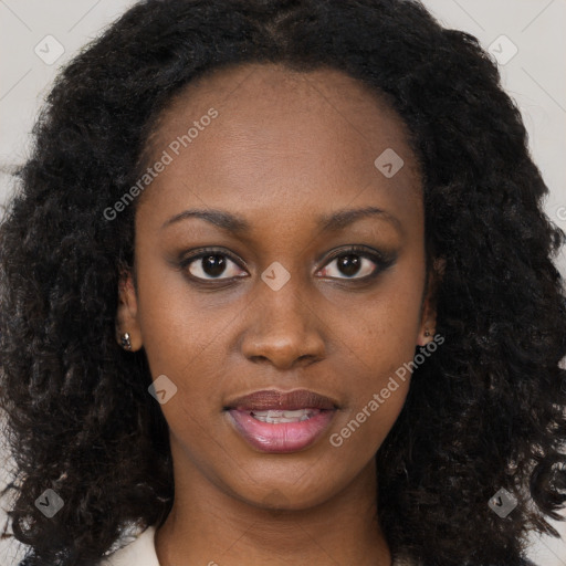 Joyful black young-adult female with long  black hair and brown eyes