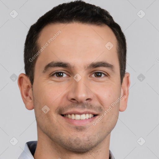 Joyful white young-adult male with short  brown hair and brown eyes