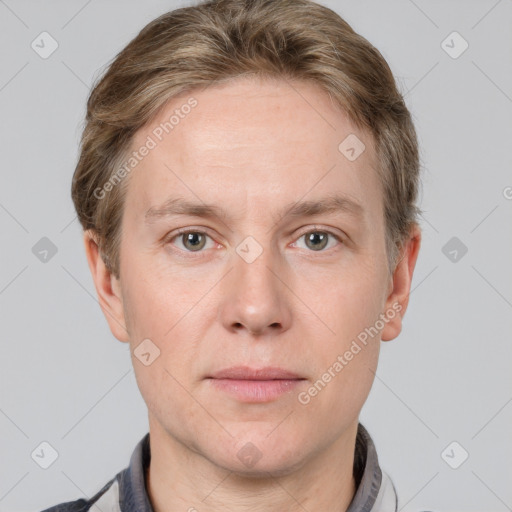 Joyful white adult male with short  brown hair and grey eyes