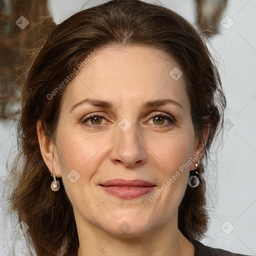 Joyful white adult female with medium  brown hair and grey eyes