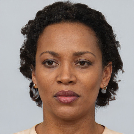 Neutral black adult female with short  brown hair and brown eyes