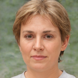 Joyful white adult female with short  brown hair and brown eyes