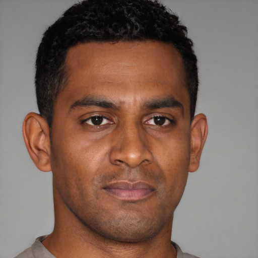 Neutral black young-adult male with short  brown hair and brown eyes