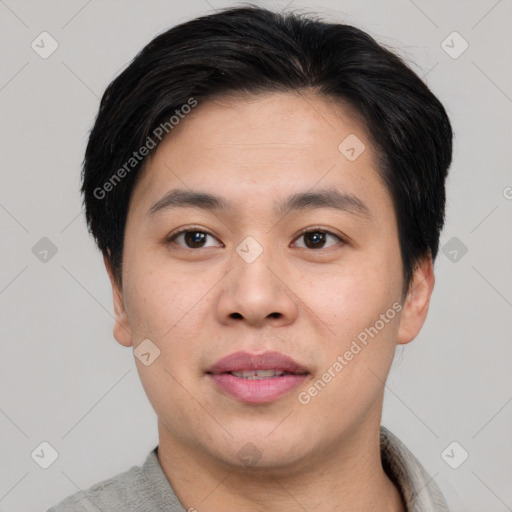 Joyful asian young-adult male with short  brown hair and brown eyes