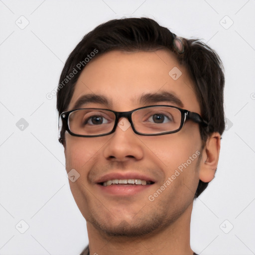 Joyful white young-adult male with short  black hair and brown eyes