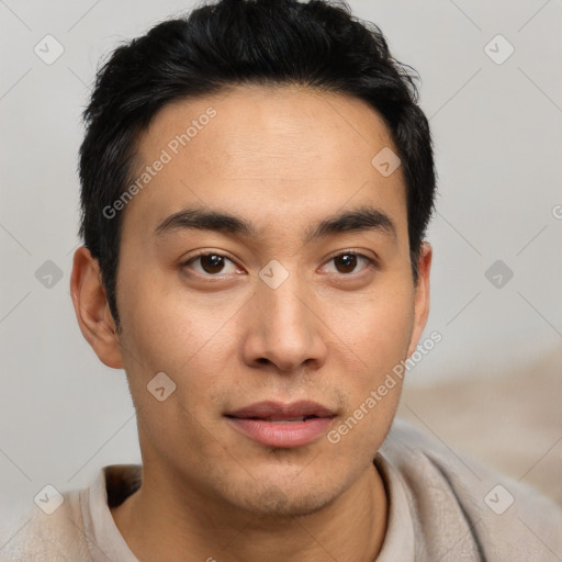 Joyful asian young-adult male with short  brown hair and brown eyes