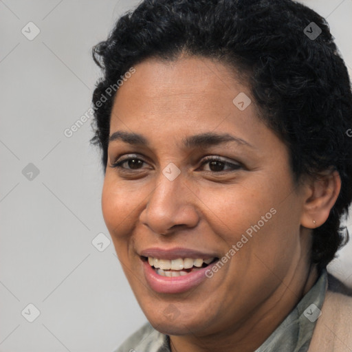 Joyful latino young-adult female with short  brown hair and brown eyes