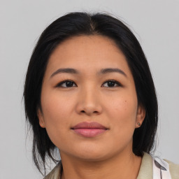 Joyful asian young-adult female with medium  black hair and brown eyes