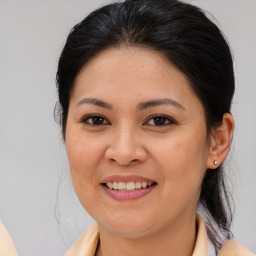 Joyful white young-adult female with medium  brown hair and brown eyes