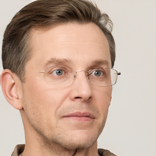 Joyful white adult male with short  brown hair and grey eyes