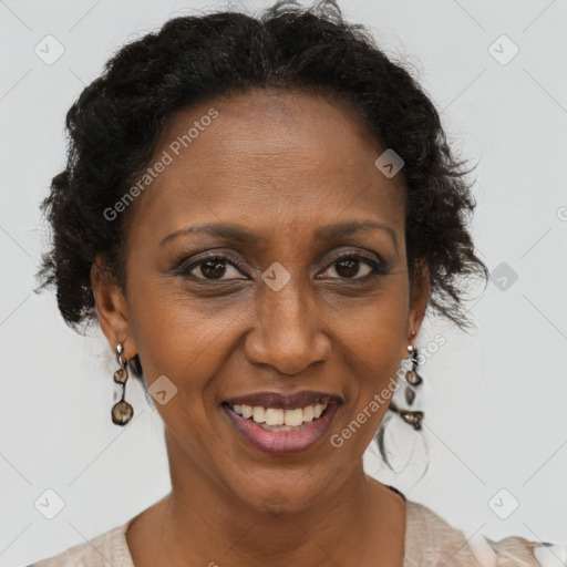 Joyful black adult female with short  brown hair and brown eyes