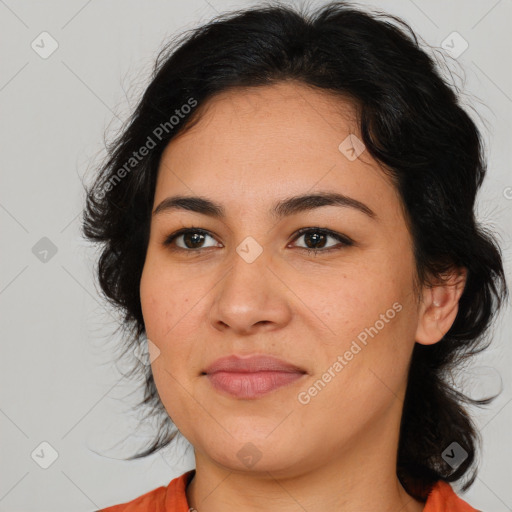 Joyful latino young-adult female with medium  brown hair and brown eyes