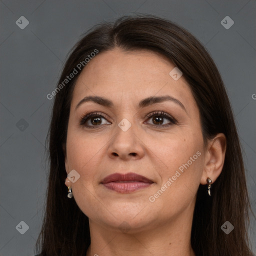 Joyful white adult female with long  brown hair and brown eyes