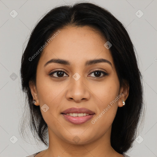 Joyful latino young-adult female with long  brown hair and brown eyes