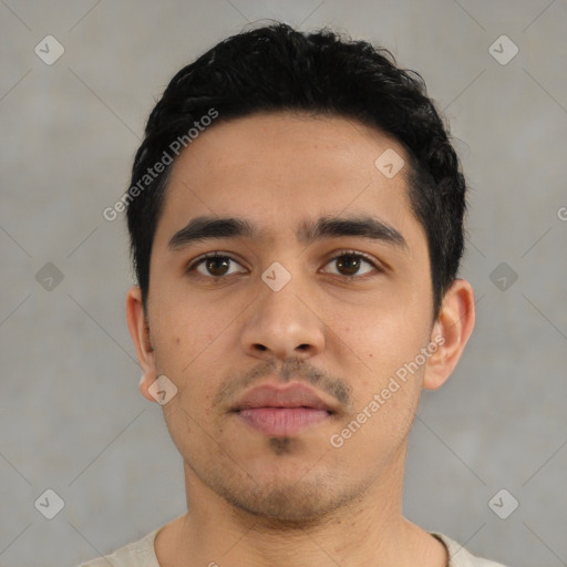 Neutral latino young-adult male with short  black hair and brown eyes