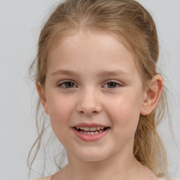 Joyful white child female with medium  brown hair and grey eyes