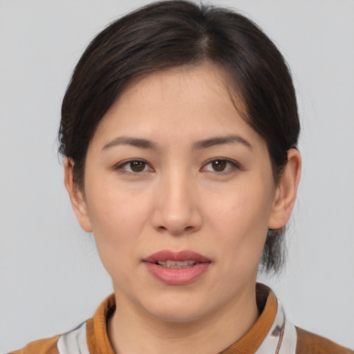 Joyful white young-adult female with medium  brown hair and brown eyes