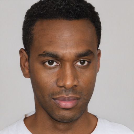 Neutral black young-adult male with short  black hair and brown eyes