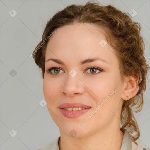 Joyful white young-adult female with medium  brown hair and green eyes