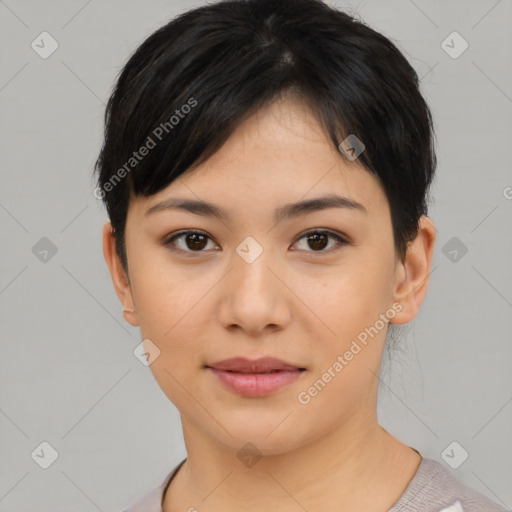 Joyful asian young-adult female with short  brown hair and brown eyes