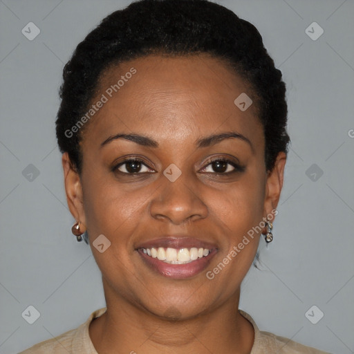 Joyful black young-adult female with short  black hair and brown eyes