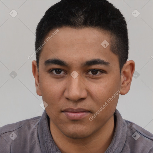 Joyful latino young-adult male with short  black hair and brown eyes