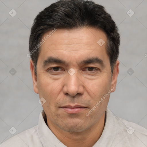 Joyful white adult male with short  black hair and brown eyes
