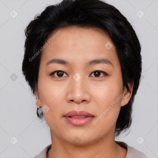 Joyful asian young-adult female with medium  black hair and brown eyes