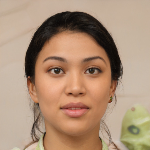 Joyful latino young-adult female with medium  brown hair and brown eyes