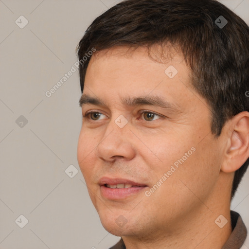 Joyful white adult male with short  brown hair and brown eyes