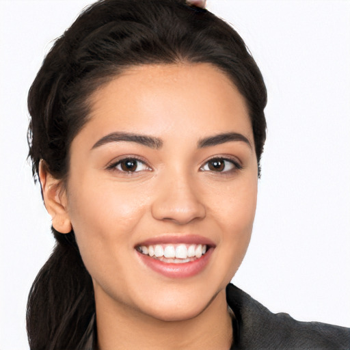 Joyful white young-adult female with long  black hair and brown eyes