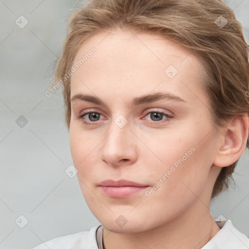 Neutral white young-adult female with medium  brown hair and grey eyes