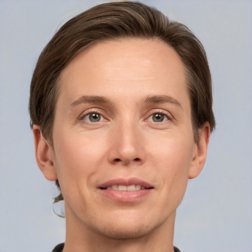 Joyful white adult male with short  brown hair and grey eyes