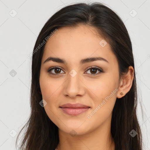 Joyful latino young-adult female with long  brown hair and brown eyes