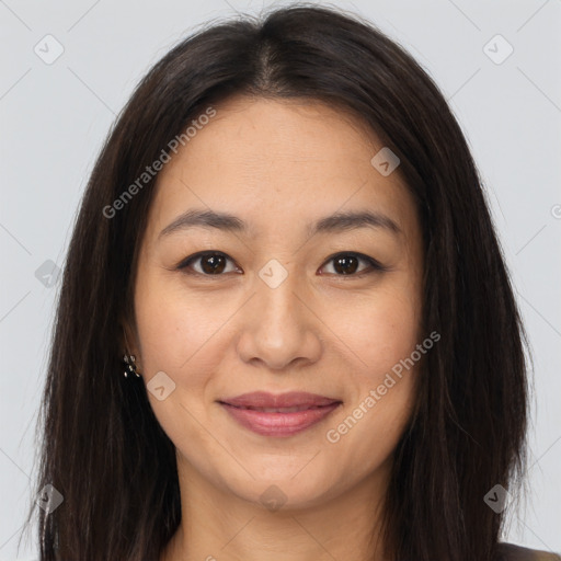 Joyful asian young-adult female with long  brown hair and brown eyes