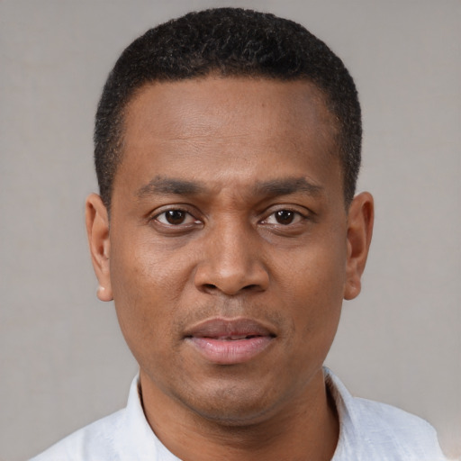 Neutral black young-adult male with short  black hair and brown eyes