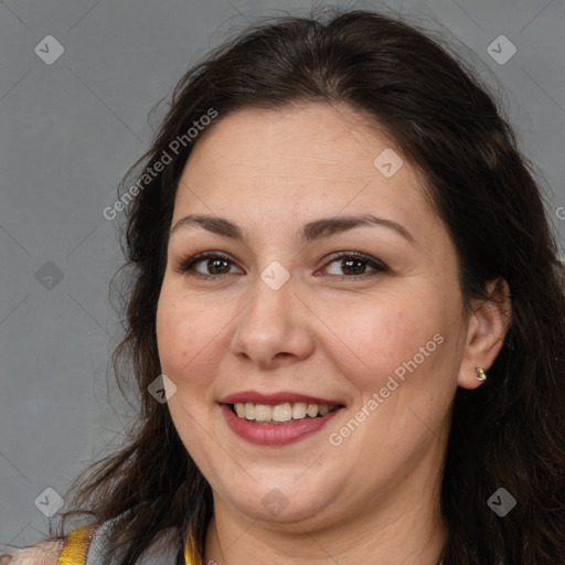 Joyful white adult female with long  brown hair and brown eyes